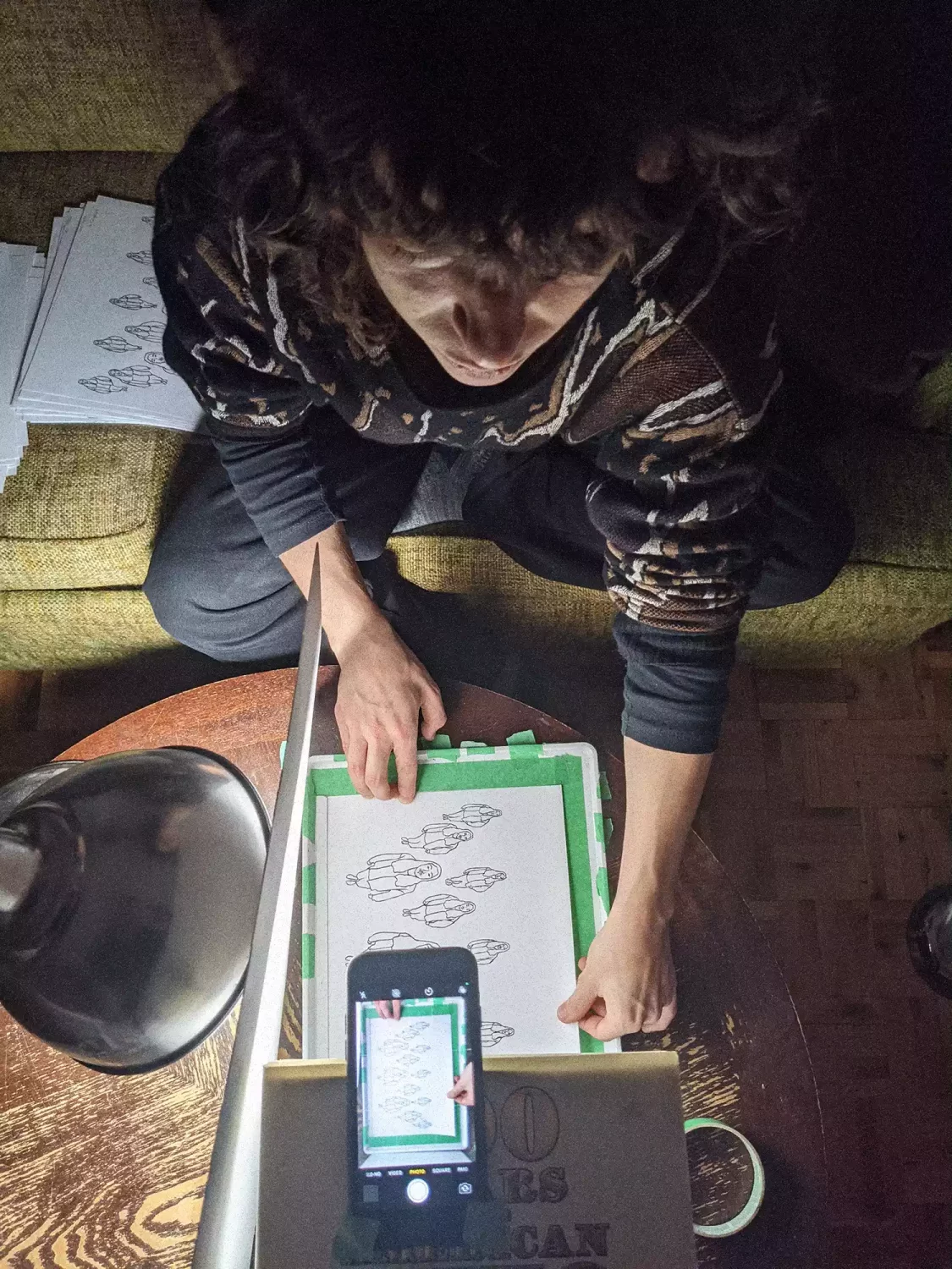 overhead shot of denise photographing the individual frames for the animated video